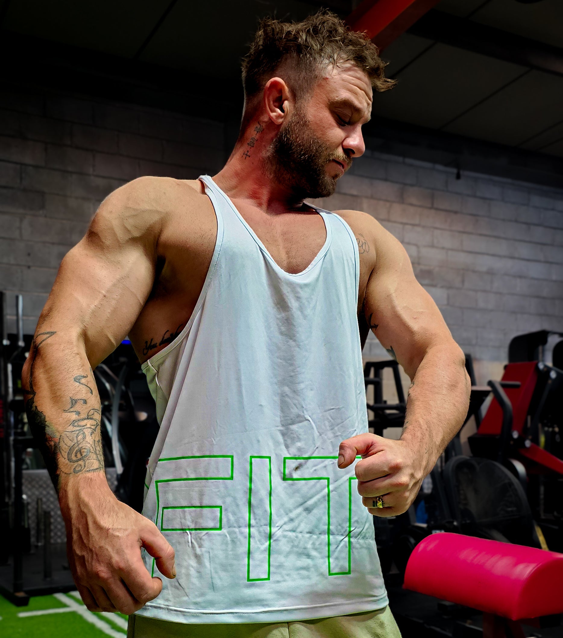 Muscle man wearing a stringer vest